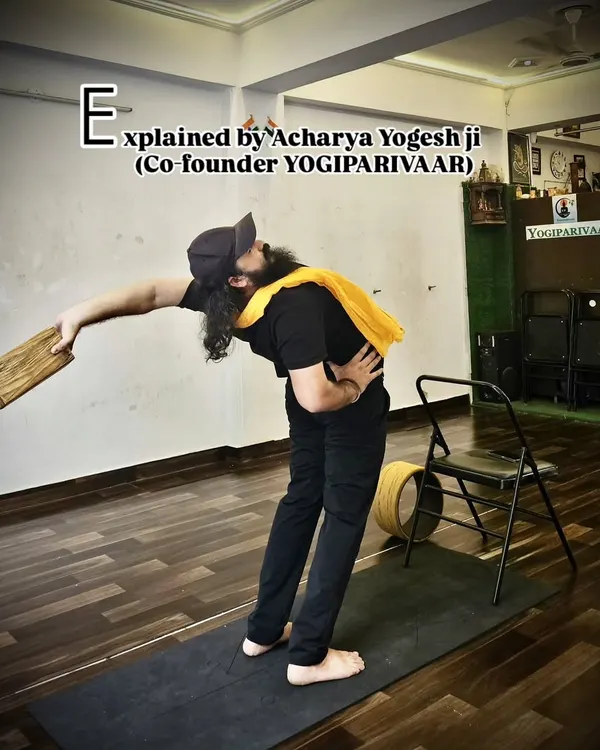 Here I am demonstrating a supported side bend using a yoga block. This prop helps maintain stability and alignment, allowing for a deeper stretch along the side of the body while protecting the lower back.