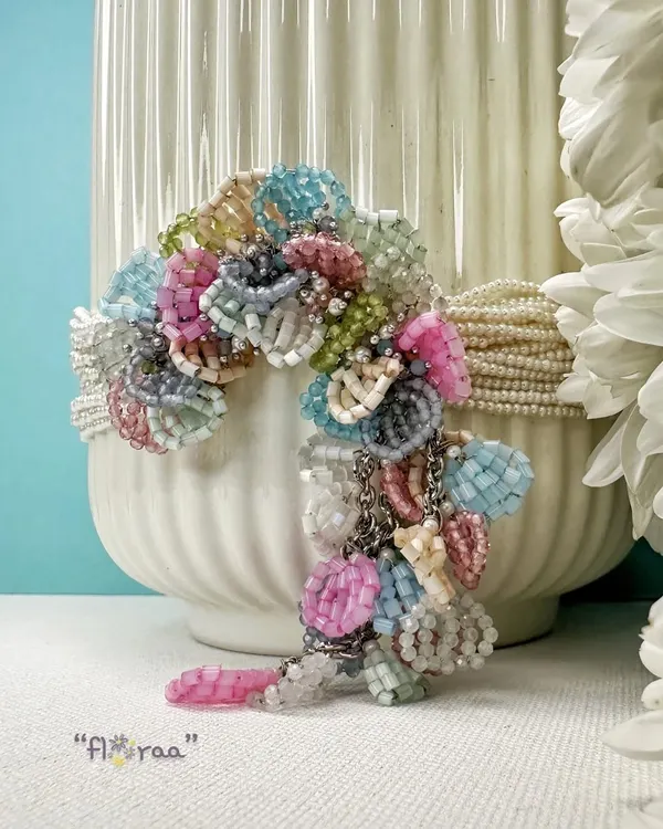 This is our classic FLORAA choker, handcrafted with a rainbow of beautiful pastel beads. It's a versatile piece designed to steal the show and add a playful touch to your festive or wedding guest look.