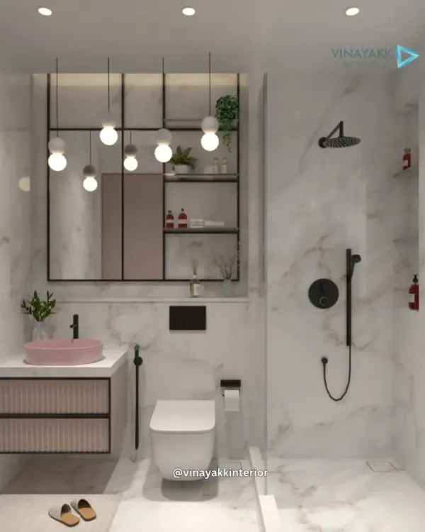 I transform bathrooms into personal spa retreats. This design uses large-format marble for a timeless, luxurious feel, contrasted with modern matte black fittings. A pop of color from the pastel pink basin and the texture of the fluted vanity add a unique, designer touch.