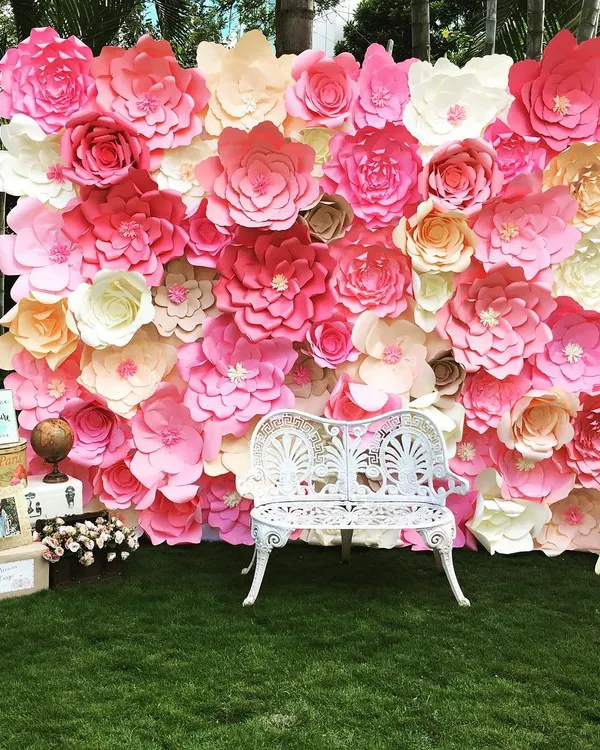 A stunning paper flower wall I created for a travel-and-floral themed baby shower. It served as the perfect photo backdrop to welcome the little one to a new adventure.