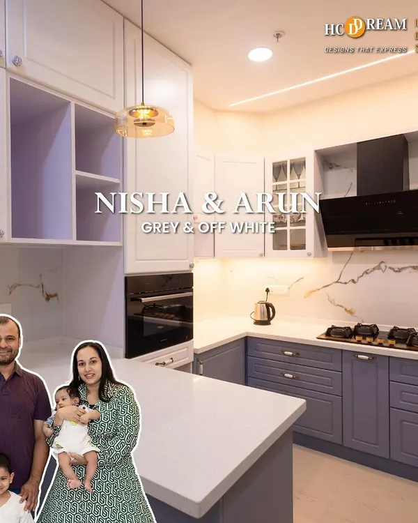 We designed this beautiful grey and off-white kitchen for Nisha and Arun's family. It features an island for extra prep space, sleek handleless cabinets, and under-cabinet lighting for a bright and functional cooking environment.