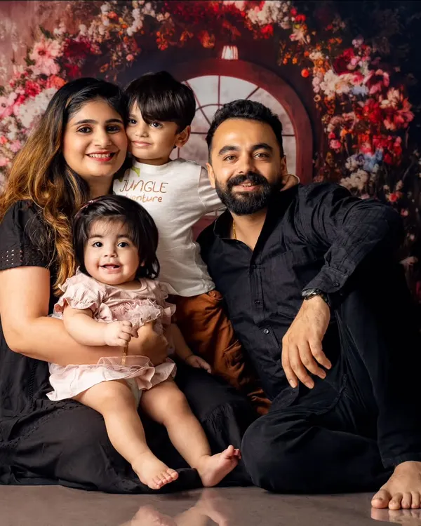 We believe the best family portraits capture the real you. This shot, with its genuine smiles and cozy vibe, is a perfect example of how we turn a studio session into a warm, memorable experience for the whole family.
