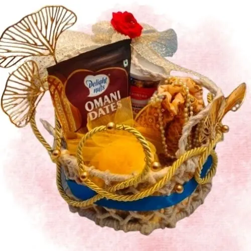 This is where elegance meets tradition. I designed this Divine Celebration Basket for a corporate client who wanted to make a lasting impression. It features a handcrafted jute basket filled with premium Omani dates and other gourmet selections, all tied together with beautiful golden accents and decorative pieces. This is a perfect example of luxury corporate gifting for festivals like Diwali.