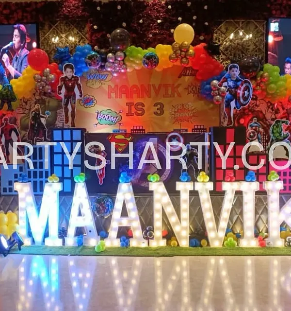 We assemble the mightiest heroes for an epic birthday bash. This Avengers stage is packed with action, featuring multiple character cutouts, city-scape backdrops, and vibrant marquee letters that put the birthday boy's name in the spotlight.