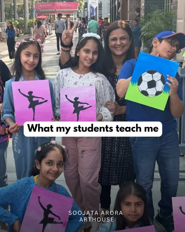 This is what it's all about. Seeing my students proudly display their creations, full of confidence and joy, is the best part of my day. Here we are after a fun canvas painting session outdoors.