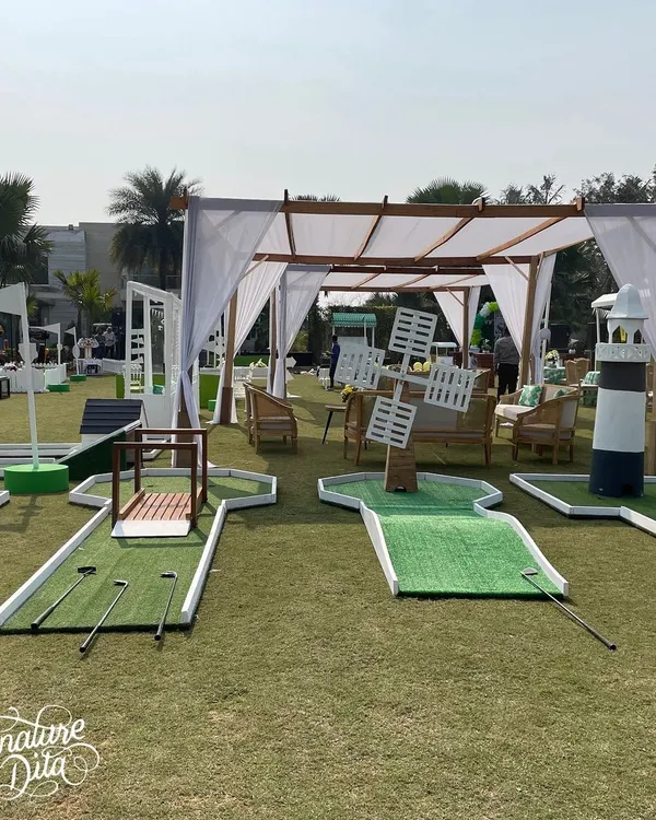 For a sports-themed party, I set up a complete mini-golf course on the lawn. Each hole had fun obstacles, like a windmill and a lighthouse, providing a great activity for kids and adults alike.