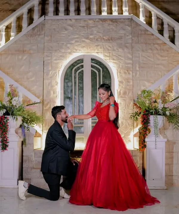 A fairytale proposal moment captured during a pre-wedding shoot. I help couples find the perfect location and provide costumes to create these magical memories. This shot was taken at an indoor set with grand architecture.
