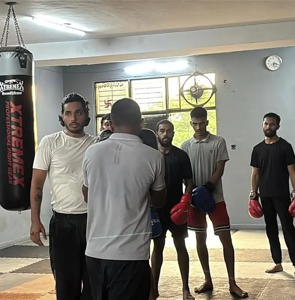 Focus on your mind. A group of students listening intently as I explain a concept. The mental aspect of boxing is as important as the physical.