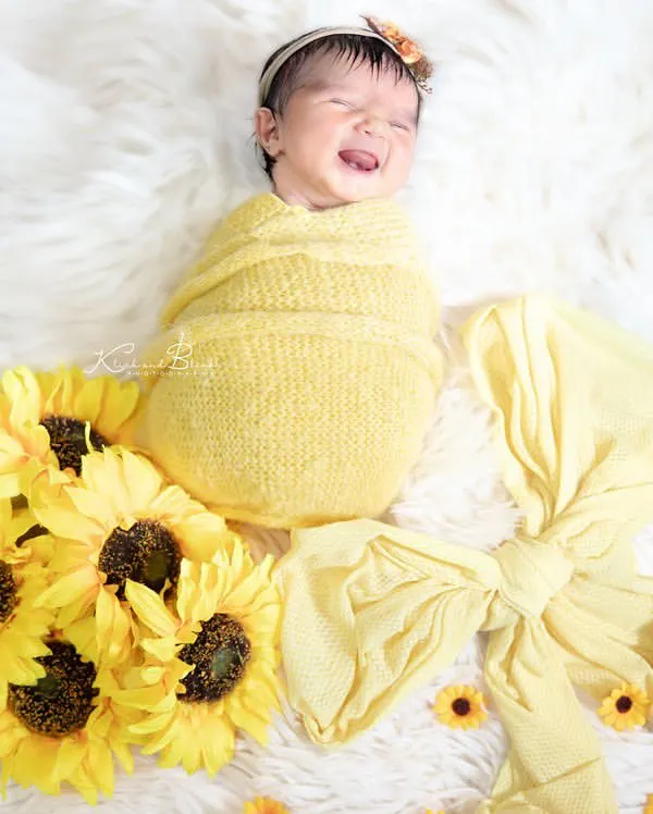 This is the art of freezing time. That priceless, fleeting smile, surrounded by the warmth of sunflowers, is a memory I was so honored to capture. These are the moments that become timeless treasures.