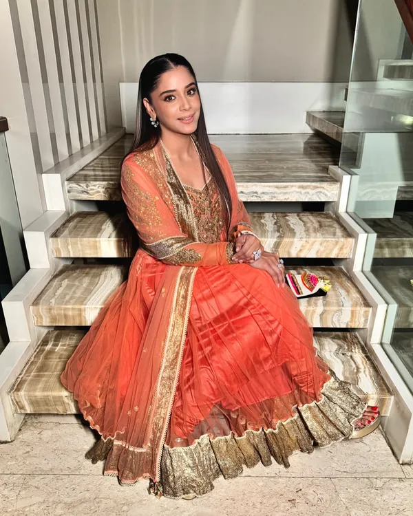Suiting up for the festive season. A beautiful orange anarkali paired with sleek hair and glowing makeup for a Diwali party.