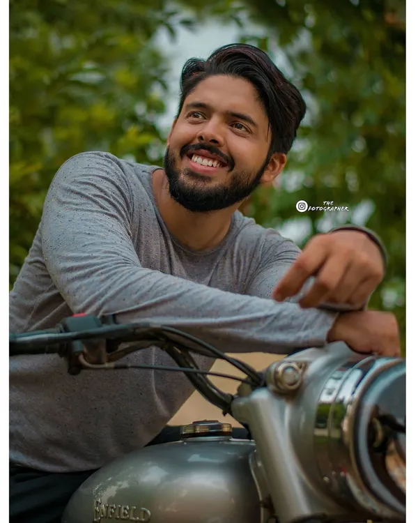 A great portrait is about capturing a feeling. This shot from a biker photoshoot focuses on the happiness and freedom associated with riding, highlighted by a natural, upward-looking smile.
