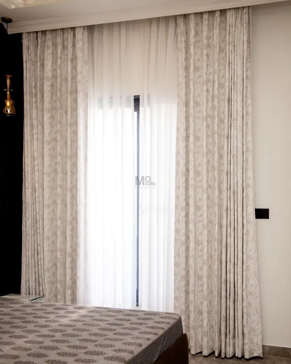 Transform your space with our premium muted-tone motorized curtains. Adorned with delicate embroidery, they offer effortless control over light and ambiance, seamlessly blending timeless style with smart living.