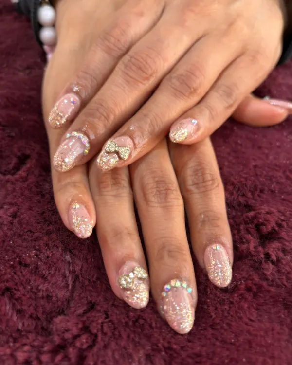 This is what we mean by a 'glow-up'. These glitter extensions feature delicate, hand-placed 3D bows and crystals for a look that's pure luxury. Perfect for when you want your nails to be the main event.