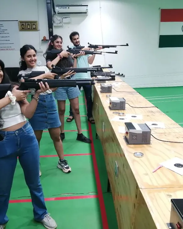 Smiles all around after a great session. It's awesome to see friends trying something new together and enjoying the challenge of target shooting.