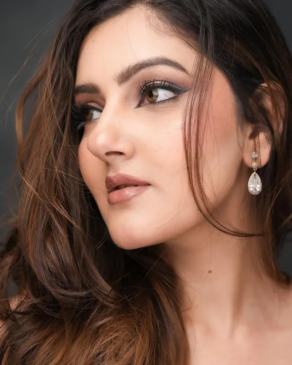 A close-up of my signature glam look. I love creating a sharp, extended winged liner paired with a soft brown smokey eye and a glossy nude lip for ultimate sophistication.
