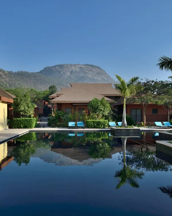 The reflection of the hills in the still water of our pool is a sight to behold. We designed this space to be a tranquil oasis, where the architecture blends seamlessly with the natural landscape for your complete serenity.