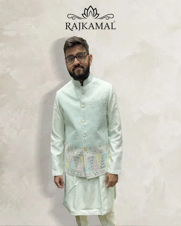 A client looking happy and comfortable in my pastel green kurta paired with a lightly embroidered jacket. This is an ideal outfit for a daytime event or a smaller ceremony.