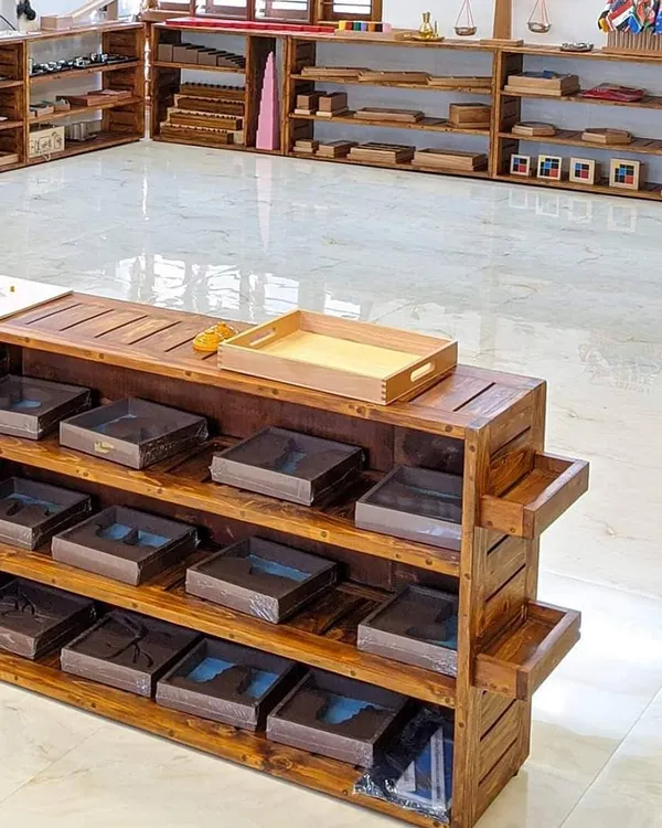 This is what I mean by a 'prepared environment'. The low, open shelves are filled with beautiful, purposeful materials, all within a child's reach. This space is intentionally designed to invite exploration and allow children to choose their own activities, fostering independence and a love for learning.