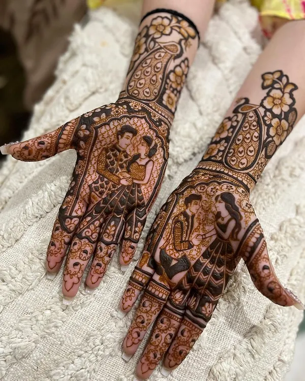 A beautiful engagement mehndi featuring two different couple portraits. I love capturing these personal moments in my designs, surrounded by delicate floral and peacock motifs.