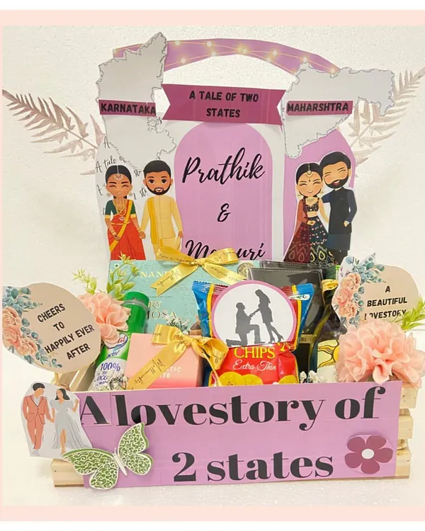 A love story of two states, told through a hamper. We designed this creative gift to celebrate a couple from Karnataka and Maharashtra, featuring custom caricatures and treats from both regions.