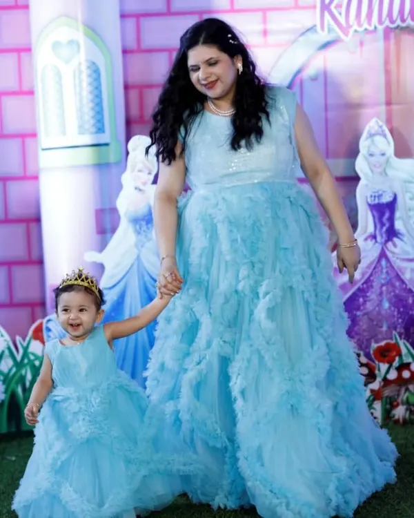 Feel like a fairy-tale princess and her queen. This client and her daughter are wearing my custom-designed blue ruffled gowns for a magical birthday party.