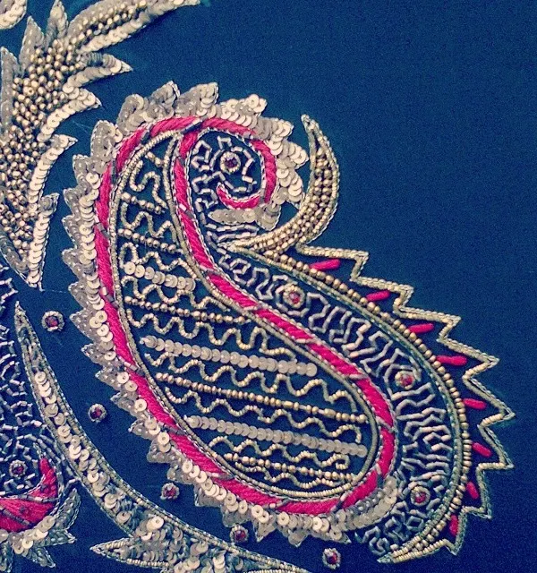 A close-up of a classic paisley motif, intricately embroidered with sequins, beads, and threadwork. This level of detail is what makes my bridal and couture pieces stand out.