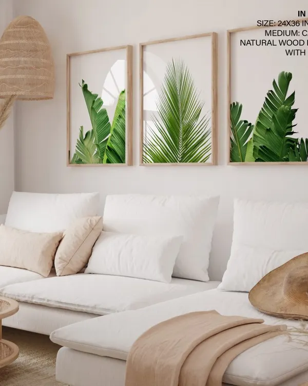 Bring the outdoors in with our set of three botanical leaf prints. This gallery wall, featuring lush banana and palm leaves in natural wood frames with glass, creates a fresh, calming atmosphere in any living room or bright space. Each piece is printed on high-quality canvas to ensure the greens stay vibrant for years.
