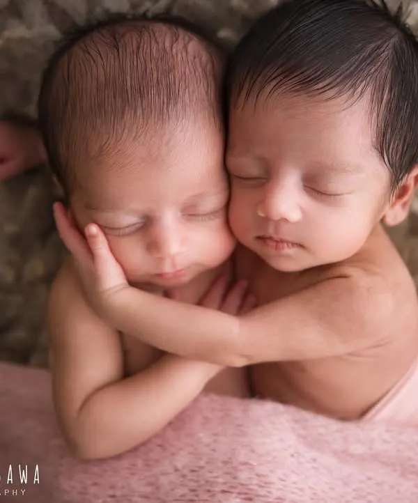 Two souls, one journey. There is a unique magic in photographing newborn twins, capturing the beginning of a bond that will last a lifetime. This is one of my favorite twin portraits, showcasing their peaceful connection.