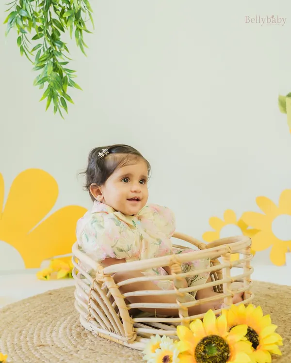 Blooming with joy just like these sunflowers. Our little sunshine lights up every moment with her giggles and charm.