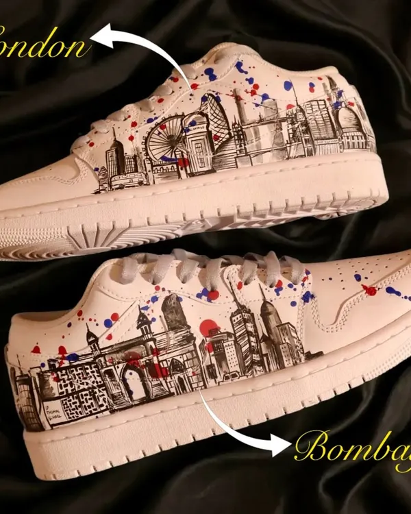A tale of two cities. I hand-painted the skylines of London and Bombay on this pair of Nike Air Jordan 1 lows, with splashes of red and blue to add a vibrant, artistic touch.