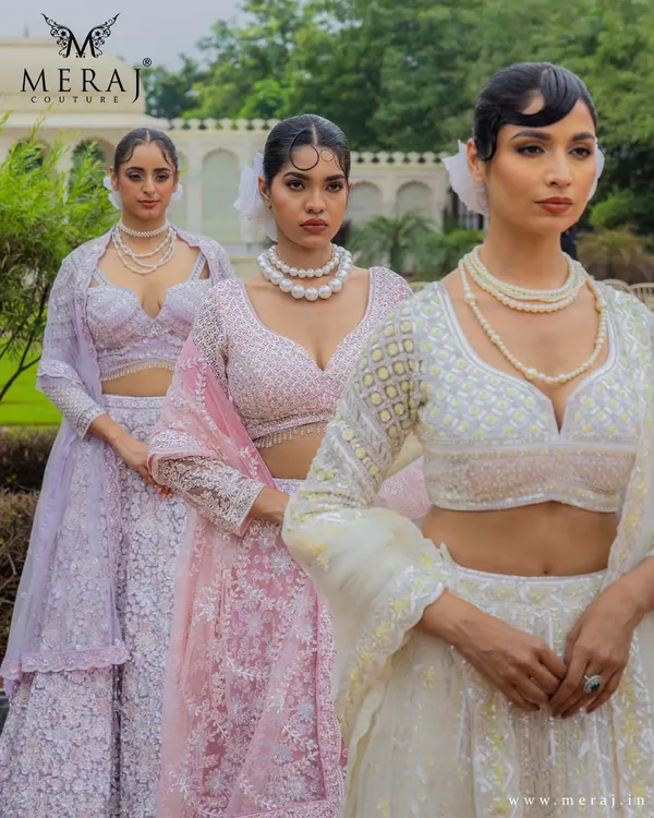 Colors that capture your heart. This image showcases my 'Ruvaah' bridal lehengas in pastel lilac and soft pink, adorned with intricate 3D florals and fine detailing.