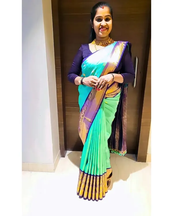 A client looking stunning in a sea-green and purple silk saree I draped for her. My focus is on creating a flawless silhouette with perfect pleats.