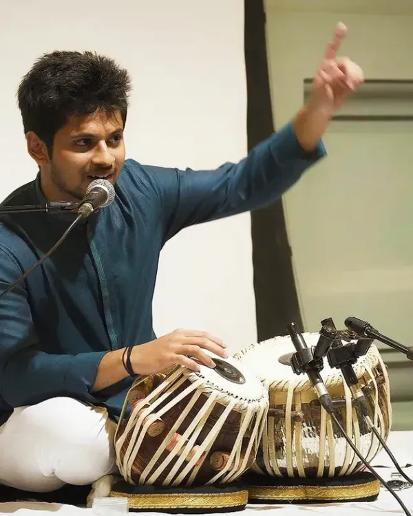 Explaining a rhythmic concept to the audience during a solo performance. I believe in making classical music accessible and sharing the stories behind the compositions.