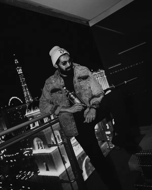 The same Loca Loka Tequila campaign with Rana Daggubati, this time in black and white. The lack of color emphasizes the textures of the denim jacket and beanie, creating a gritty, timeless feel.