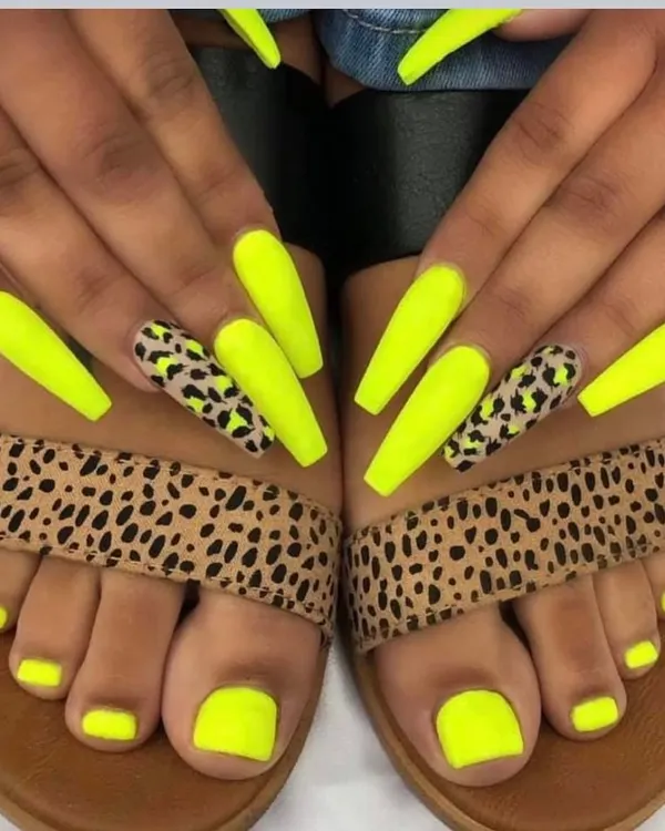I love creating matching manicure and pedicure sets. This client went for a bold neon yellow with leopard print accent nails on her hands, perfectly coordinating with her solid neon toes.
