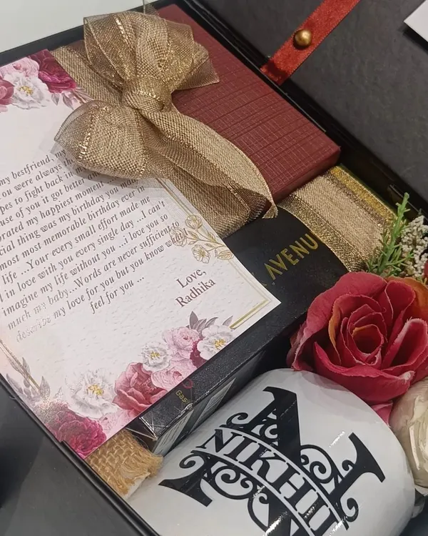 A perfect 'first salary' gift for a boyfriend. This hamper includes a personalized mug and diary, a heartfelt letter, and a box of his favorite accessories.