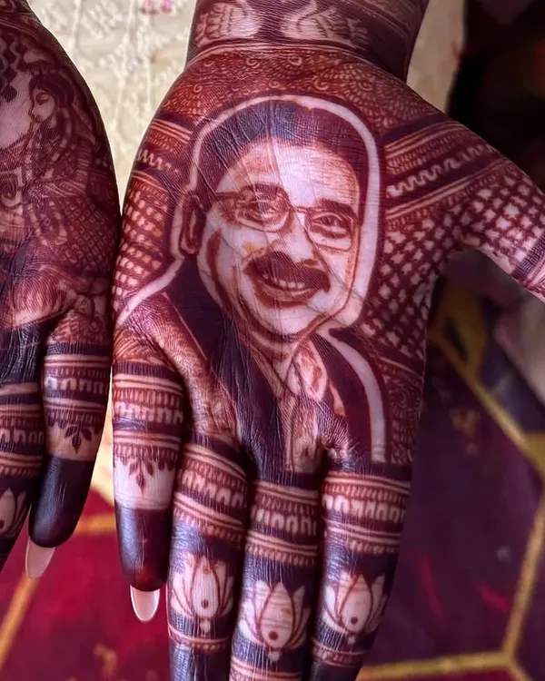 The beautiful, dark stain of the 'Papa meri jaan' portrait, achieved with my homemade, 100% natural henna paste. This shows the final color you can expect a few days after application.