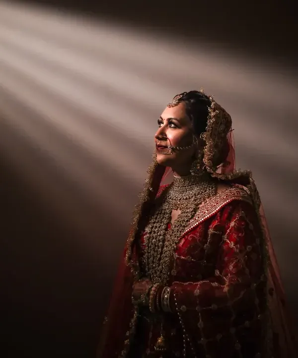 Bathed in a celestial glow, this is a moment of quiet contemplation before a new beginning. I use light and shadow to create not just a photo, but a piece of art that reflects the bride's inner grace and emotion.