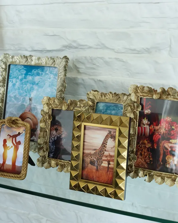 An eclectic collection of our decorative photo frames, showcasing the variety of styles we offer. From antique gold finishes to modern studded designs, there is a frame to match any decor and personality.