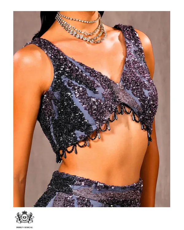 A close-up of the hand-beaded blouse. You can see the detailed sequin patterns and delicate drop beads that my team meticulously applies to create a look of pure glamour.