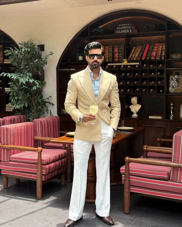 The full expression of our beige double-breasted suit. Paired with flared white trousers, this outfit exudes a retro-inspired elegance, showcasing a complete, head-to-toe bespoke look.