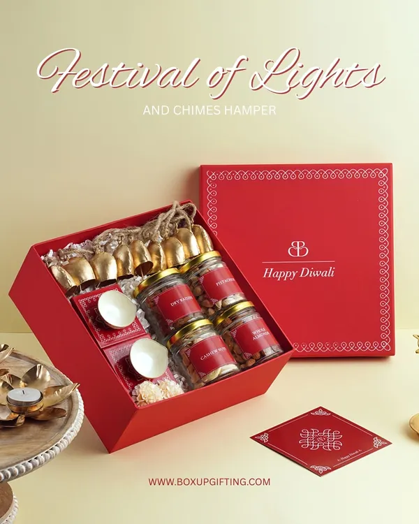 Our "Festival of Lights and Chimes" hamper was a bestseller for a reason. This vibrant red box is filled with jars of nuts, sweets, and a string of brass bells, making it a complete Diwali gift set.