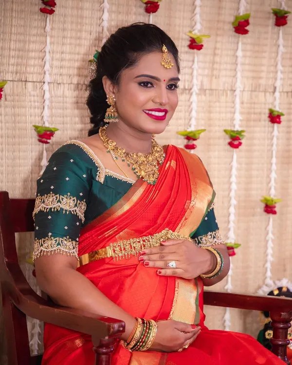 This is one of my favorite looks for a baby shower. I focused on creating flawless, glowing skin and a bright red lip to match the joy of the occasion, making sure she felt as radiant as she looked.