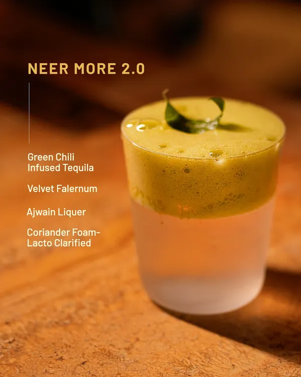 Neer More 2.0, but make it wild. This fiery twist on a South Indian classic features green chili-infused tequila, ajwain liqueur, and a coriander foam.