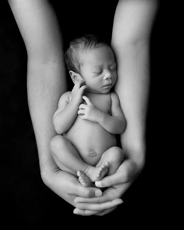 This is what it’s all about. Capturing the immense love that surrounds such a tiny, perfect being. I create these timeless black and white portraits to focus purely on the emotion and connection, turning a fleeting moment into a piece of art for your family.