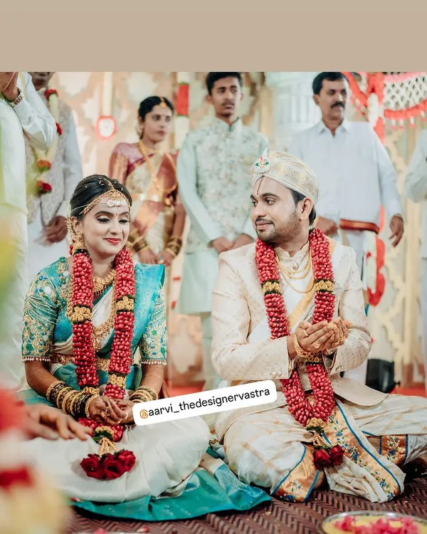 A beautiful moment from the wedding ceremony. Our bride and groom look perfect together in their custom coordinated outfits.