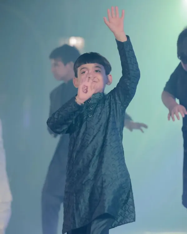 A little star waving to the crowd during his sangeet performance. I love seeing the confidence and joy on the kids' faces when they dance.
