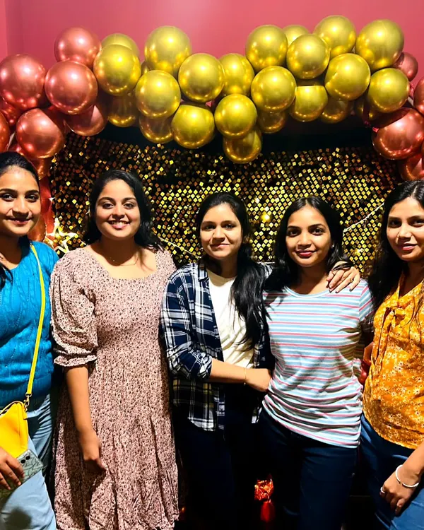 A happy group of friends posing for a photo during their hangout session. This is what it's all about: making good memories together.