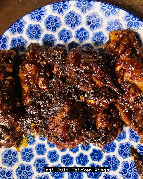 My Inji Puli, a sweet and tangy ginger-tamarind relish, is the secret behind these incredible chicken wings. Pan-fried for a crunchy exterior, the wings are coated in the zesty sauce, creating a flavour explosion that is spicy, sweet, and sour all at once.