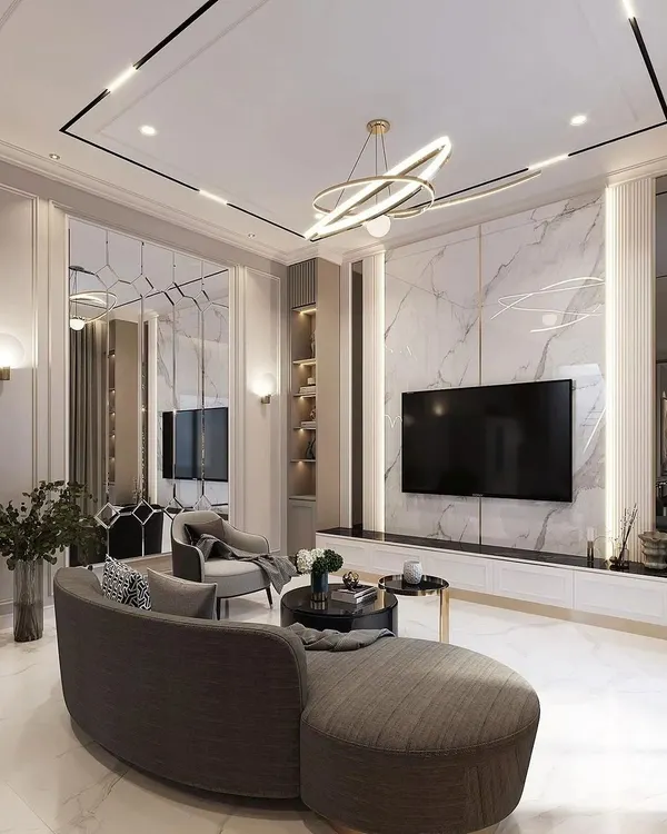 Another view of this luxurious living room, highlighting the reflective properties of the marble-clad TV wall and mirrored panels that enhance the sense of space.